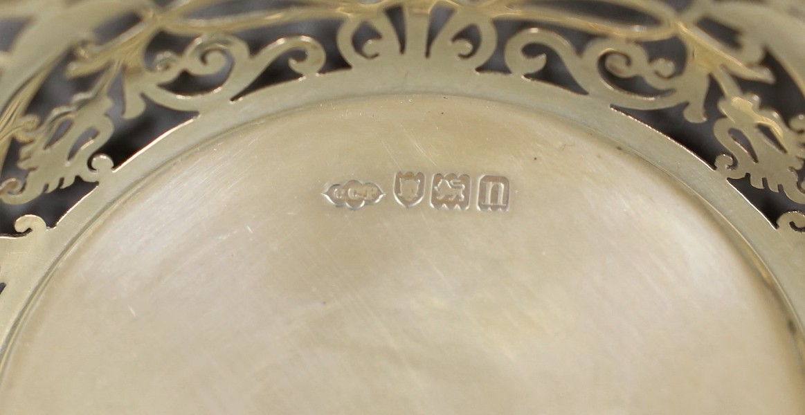 Seven assorted Victorian and later pierced silver nut or bonbon dishes, largest 22.6cm in diameter, 19.4oz.